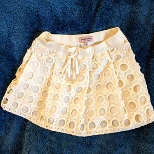 Juicy Couture Eyelet skirt Cream colored with gold tone accents Size XS